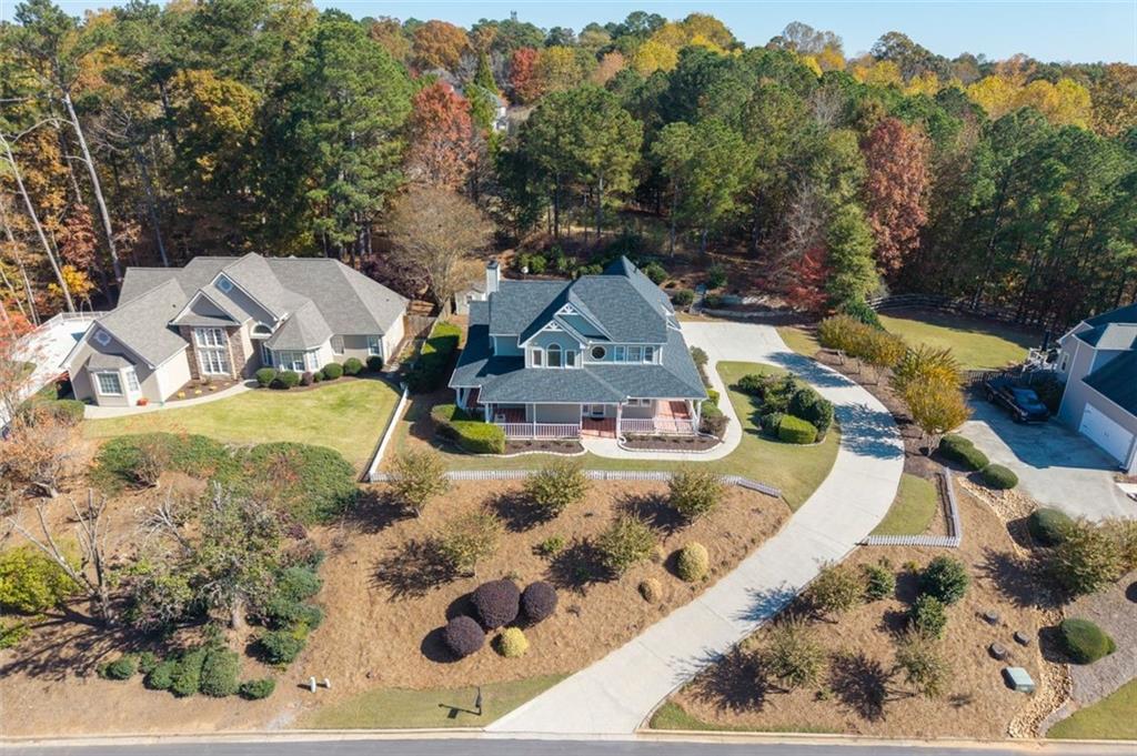 2935 Cobblestone Drive Cumming, GA 30041 - Photo 49 of 53 an aerial view of a house with a yard and trees