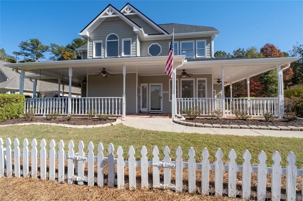 2935 Cobblestone Drive Cumming, GA 30041 - Photo 5 of 53 a front view of a house with a garden
