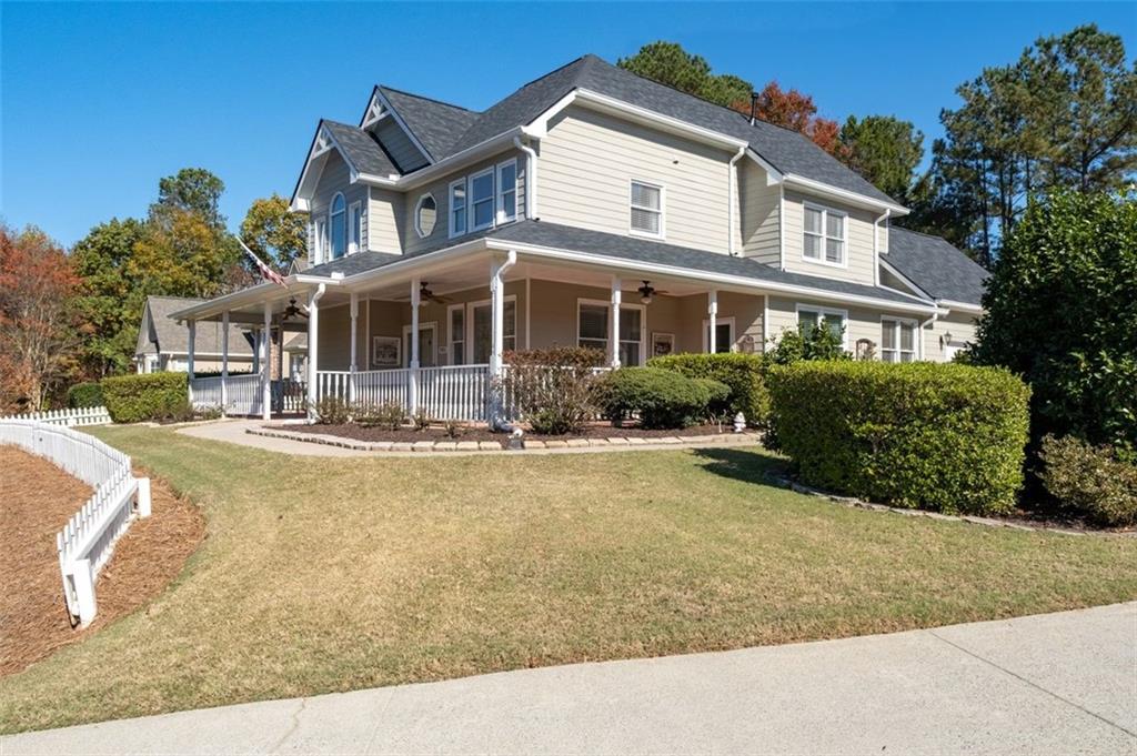 2935 Cobblestone Drive Cumming, GA 30041 - Photo 53 of 53 a front view of a house with a yard table and chairs