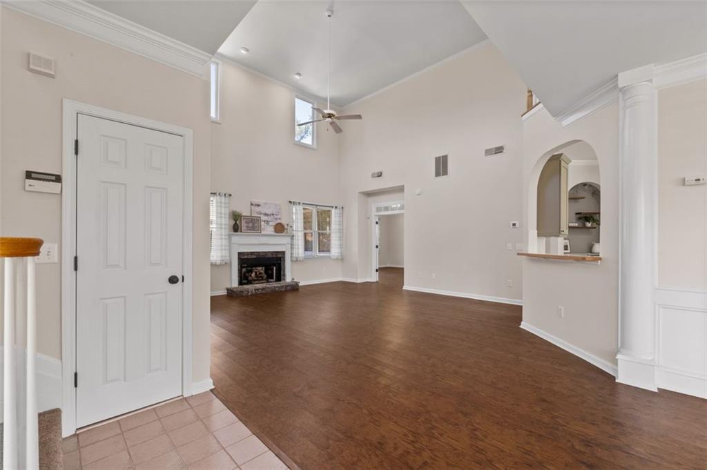 2935 Cobblestone Drive Cumming, GA 30041 - Photo 8 of 53 a view of empty room with wooden floor and fireplace