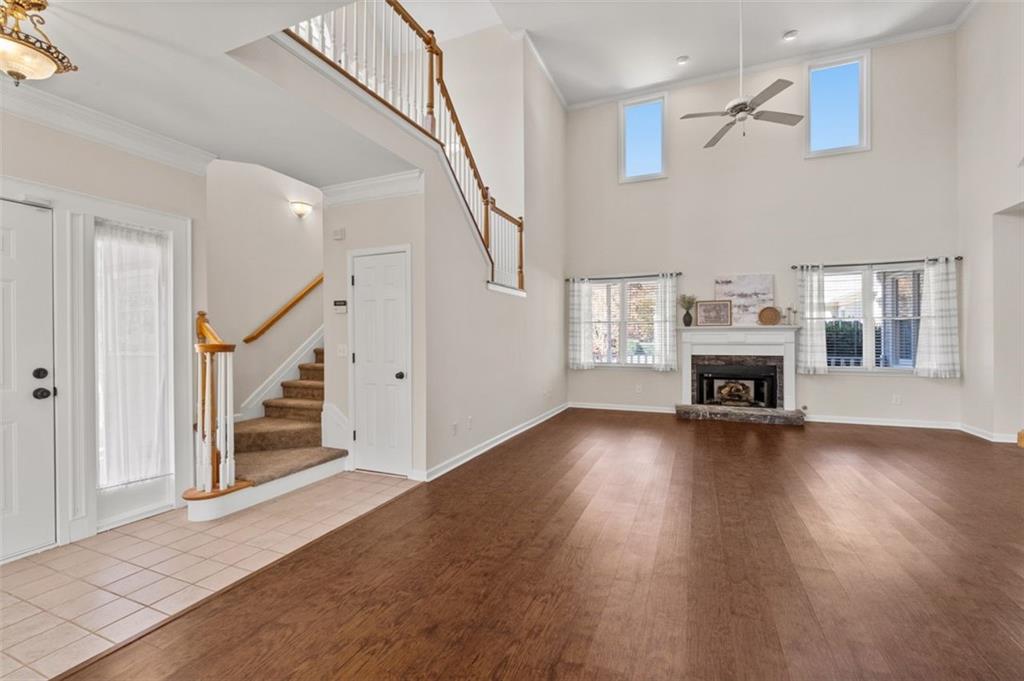2935 Cobblestone Drive Cumming, GA 30041 - Photo 9 of 53 a view of a livingroom with wooden floor and a fireplace
