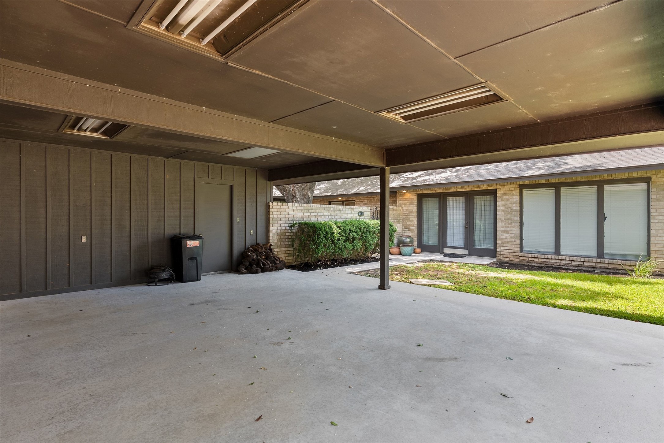 141 Perry Lane Kingsland, TX 78639 - Photo 39 of 40 A sheltered carport provides convenient parking with direct access to a private courtyard and home entrance.