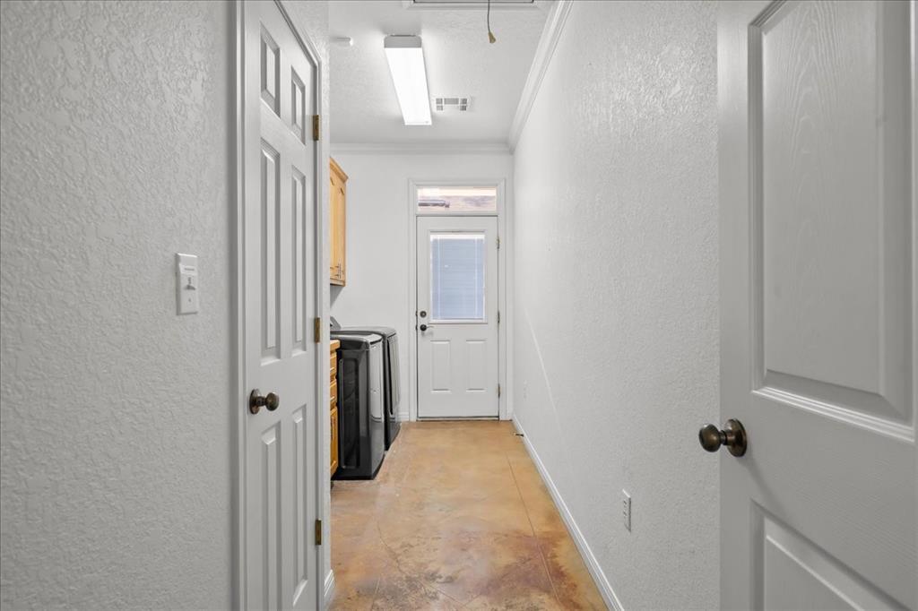 8300 Jonquil Drive Waco, TX 76708 - Photo 14 of 40 a view of a hallway with a white walls