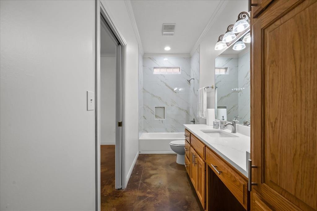 8300 Jonquil Drive Waco, TX 76708 - Photo 15 of 40 a bathroom with a granite countertop sink a mirror and a bathtub