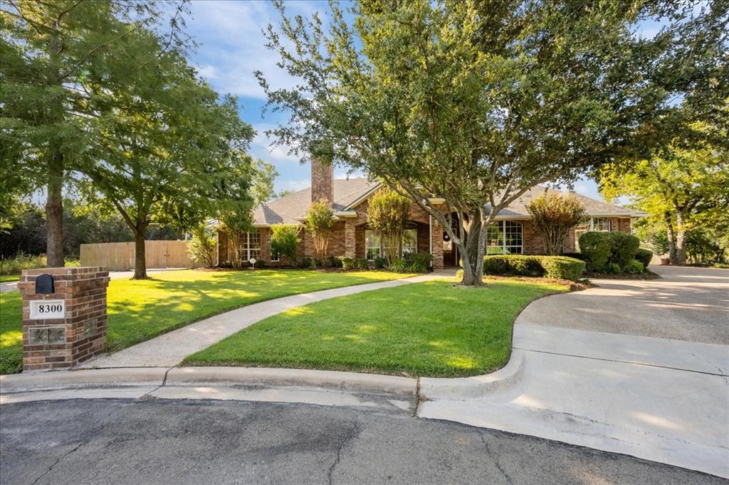 8300 Jonquil Drive Waco, TX 76708 - Photo 2 of 40 a view of a park with large trees