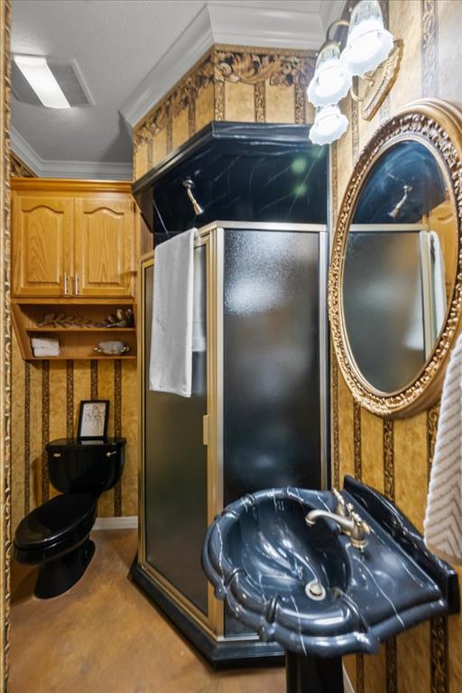 8300 Jonquil Drive Waco, TX 76708 - Photo 28 of 40 a bathroom with a sink a mirror and glass door