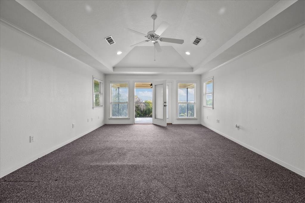 8300 Jonquil Drive Waco, TX 76708 - Photo 31 of 40 a view of a livingroom with a ceiling fan and window