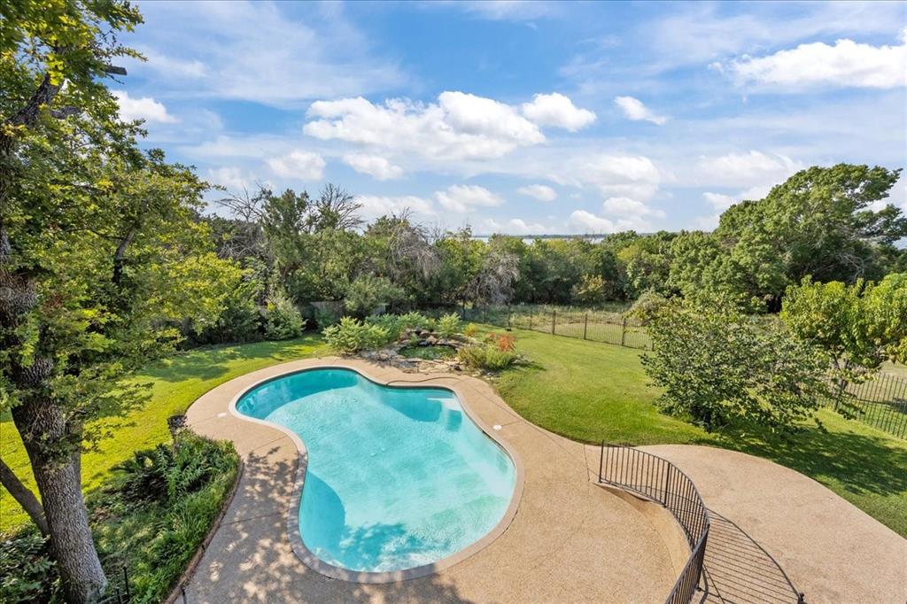 8300 Jonquil Drive Waco, TX 76708 - Photo 35 of 40 a view of a swimming pool with a yard