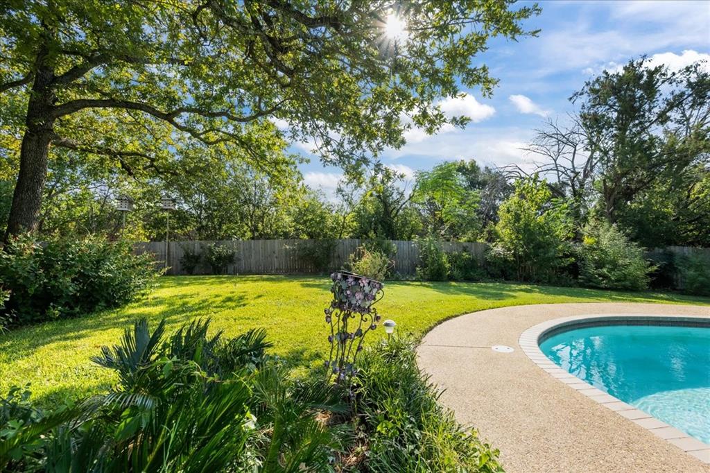 8300 Jonquil Drive Waco, TX 76708 - Photo 37 of 40 a view of a swimming pool with a yard