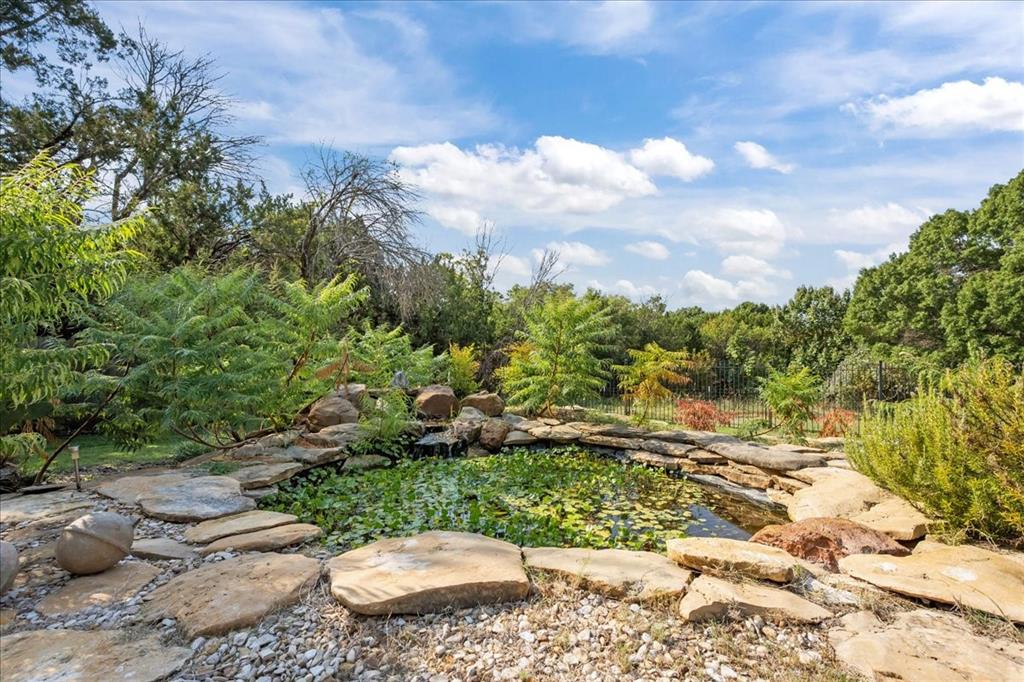 8300 Jonquil Drive Waco, TX 76708 - Photo 38 of 40 a view of a backyard with plants and trees