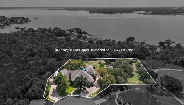 an aerial view of a house having lake view
