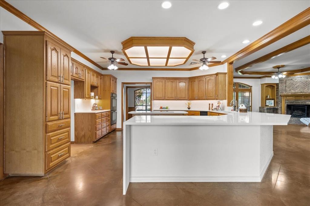 8300 Jonquil Drive Waco, TX 76708 - Photo 7 of 40 a large kitchen with a large counter top appliances and cabinets