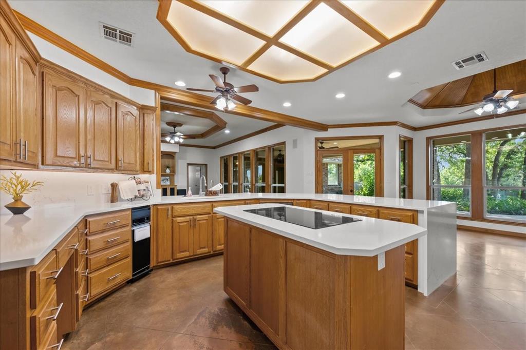 8300 Jonquil Drive Waco, TX 76708 - Photo 9 of 40 a kitchen with stainless steel appliances granite countertop sink stove and refrigerator