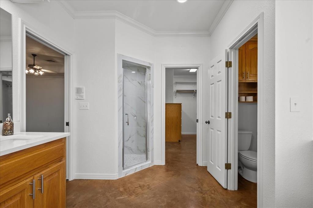 8300 Jonquil Drive Waco, TX 76708 - Photo 10 of 40 a view of a bathroom with a shower and a sink