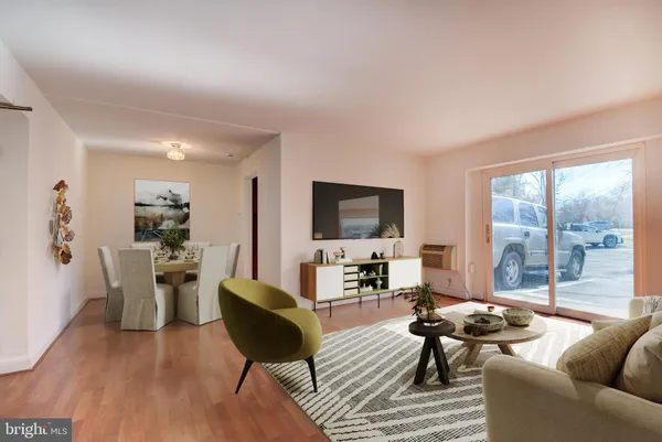 a living room with furniture or outdoor view and a large window