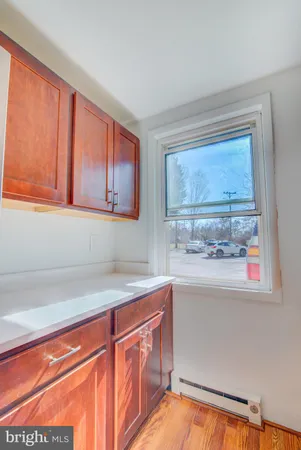 a kitchen with stainless steel appliances granite countertop a sink and a window