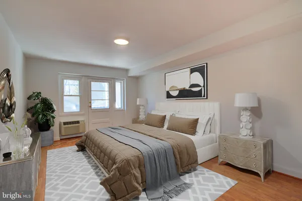 a bedroom with a large bed and a couch