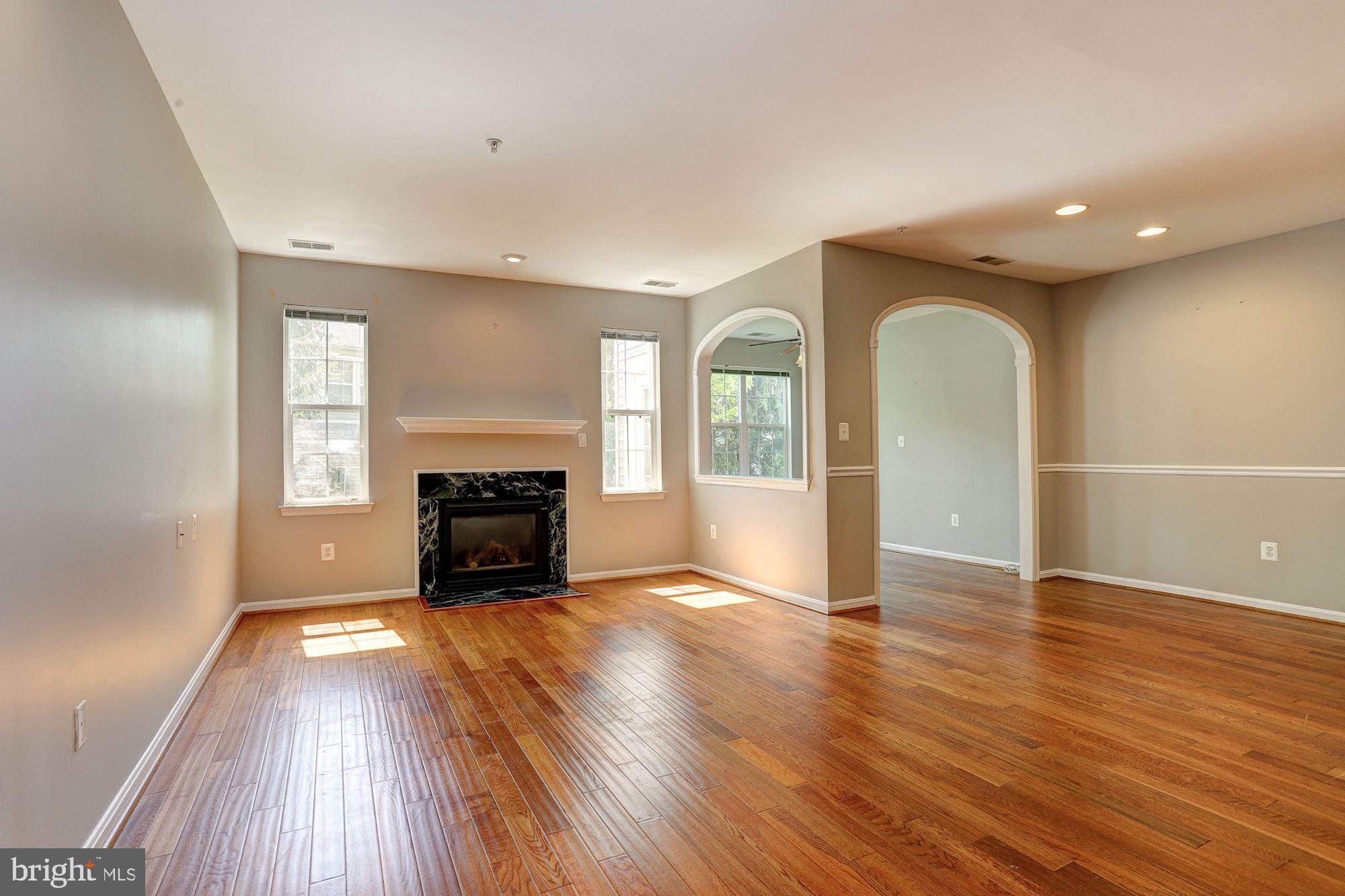 3 Hawk Rise Lane, Unit 103 Owings Mills, MD 21117 - Photo 7 of 41 HArdwood Floors and Gas Fireplace