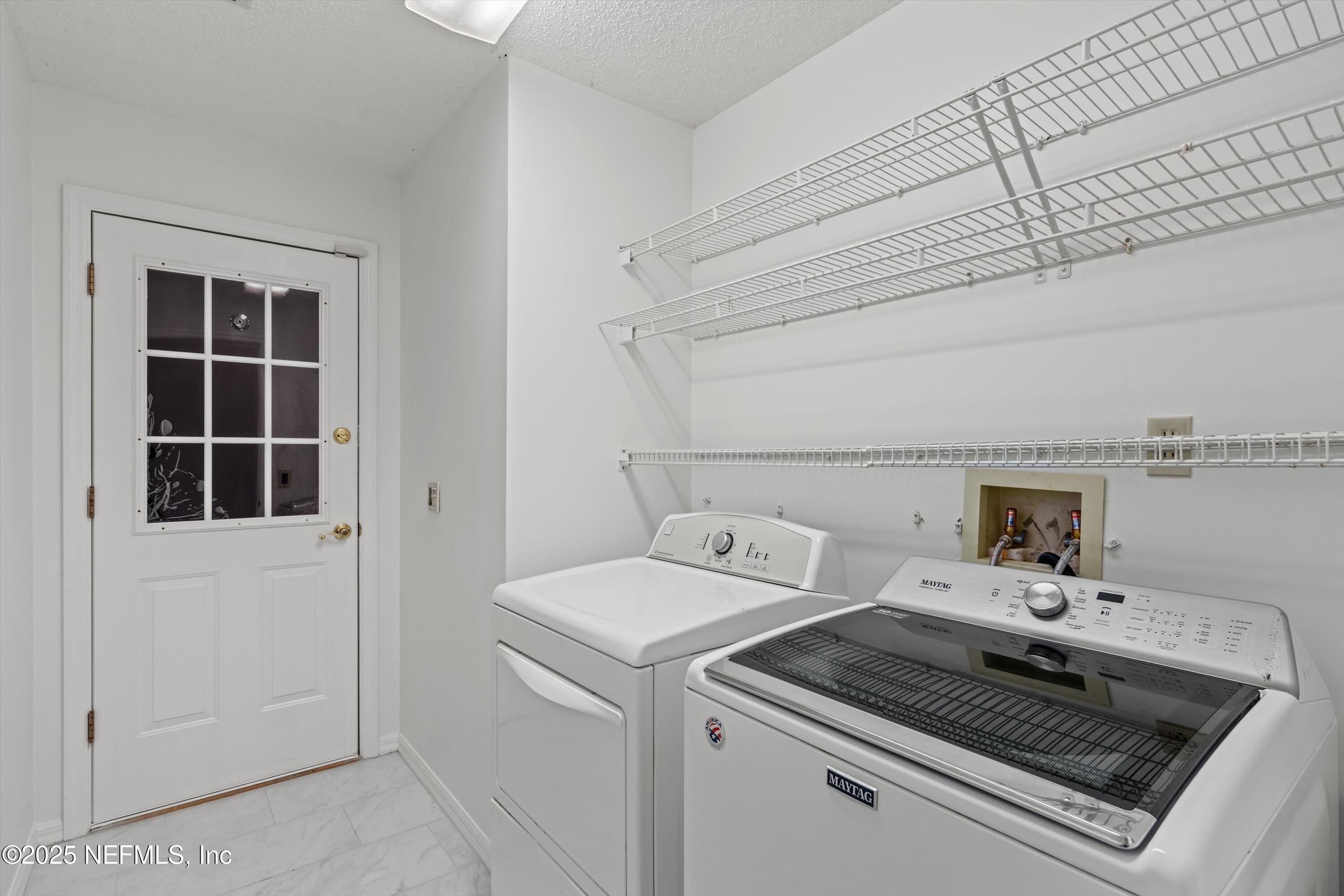 3297 Turtle Creek Road St. Augustine, FL 32086 - Photo 17 of 35 a utility room with dryer and washer