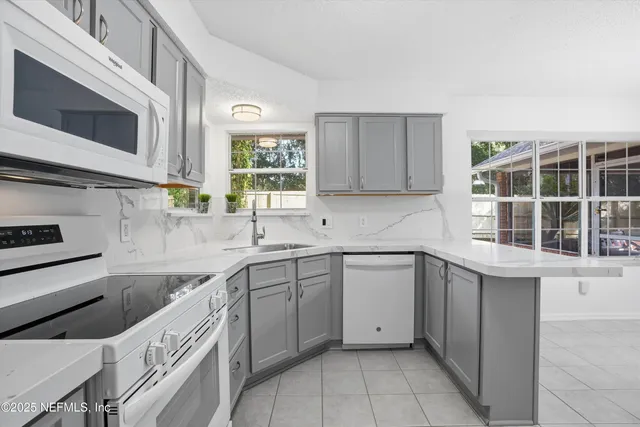a bathroom with a sink double vanity and a shower