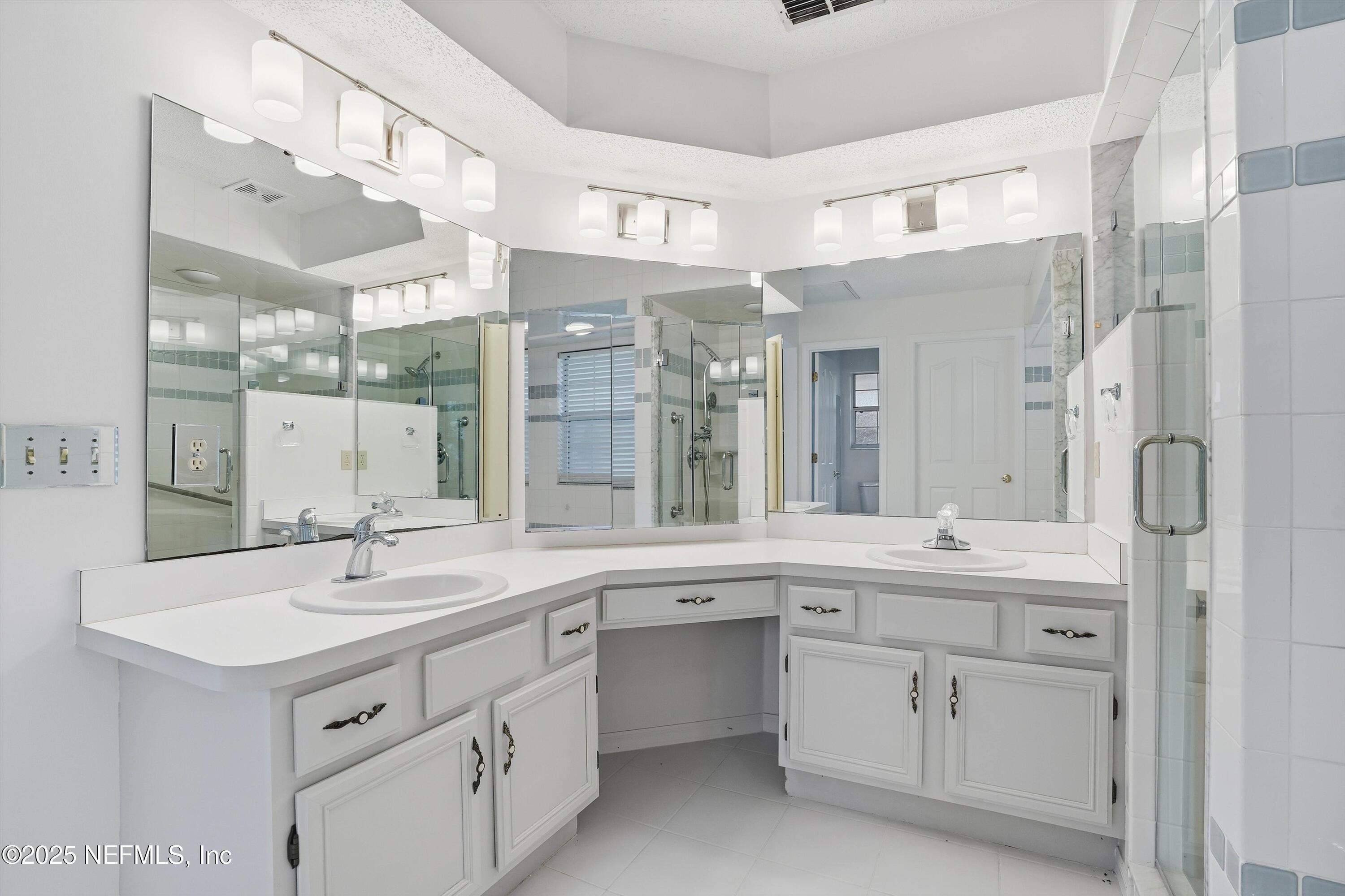 3297 Turtle Creek Road St. Augustine, FL 32086 - Photo 31 of 35 a bathroom with a sink double vanity and a shower