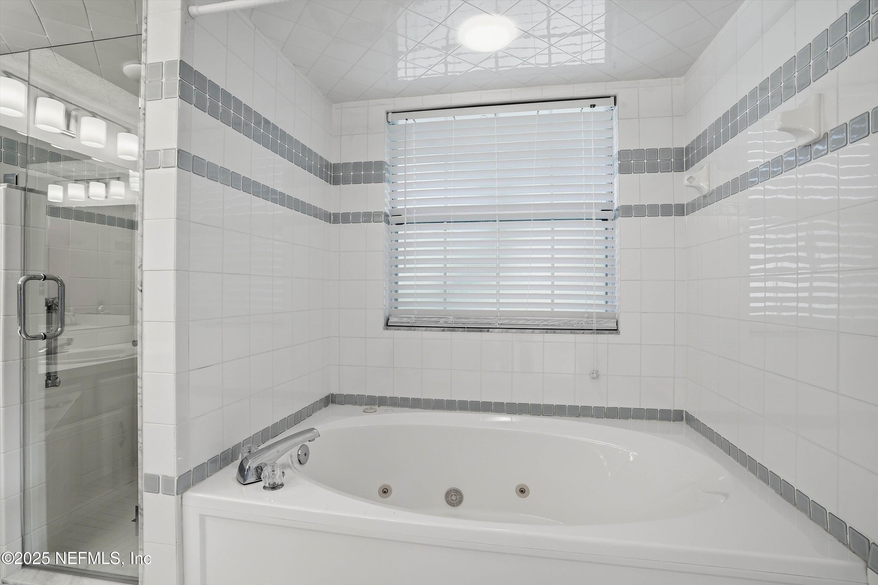 3297 Turtle Creek Road St. Augustine, FL 32086 - Photo 32 of 35 a bathroom with a bathtub