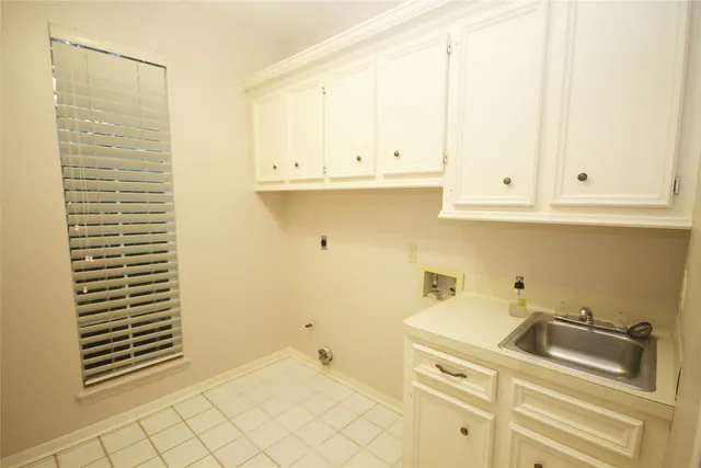 a bathroom with a sink and cabinets