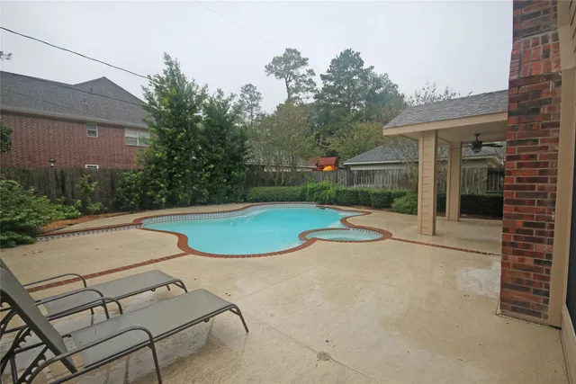 a view of a backyard with trampoline
