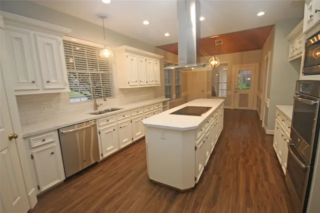 a kitchen with wooden cabinets and sink