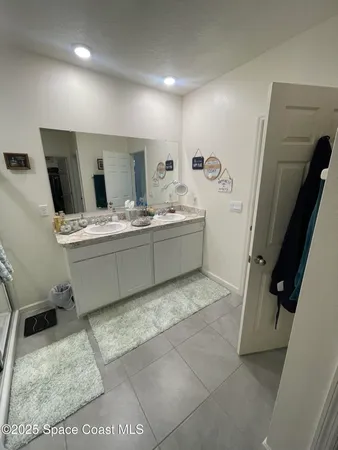 a bedroom with bed and window