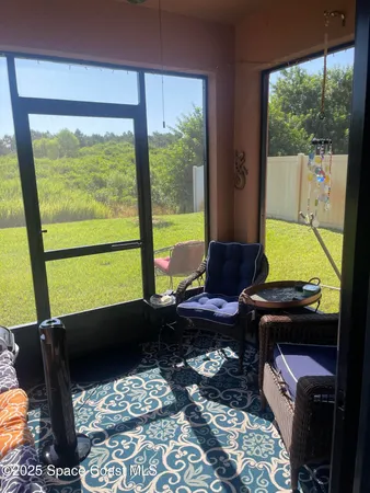 a patio with table and chairs