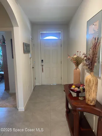 a view of a room with a table and chairs