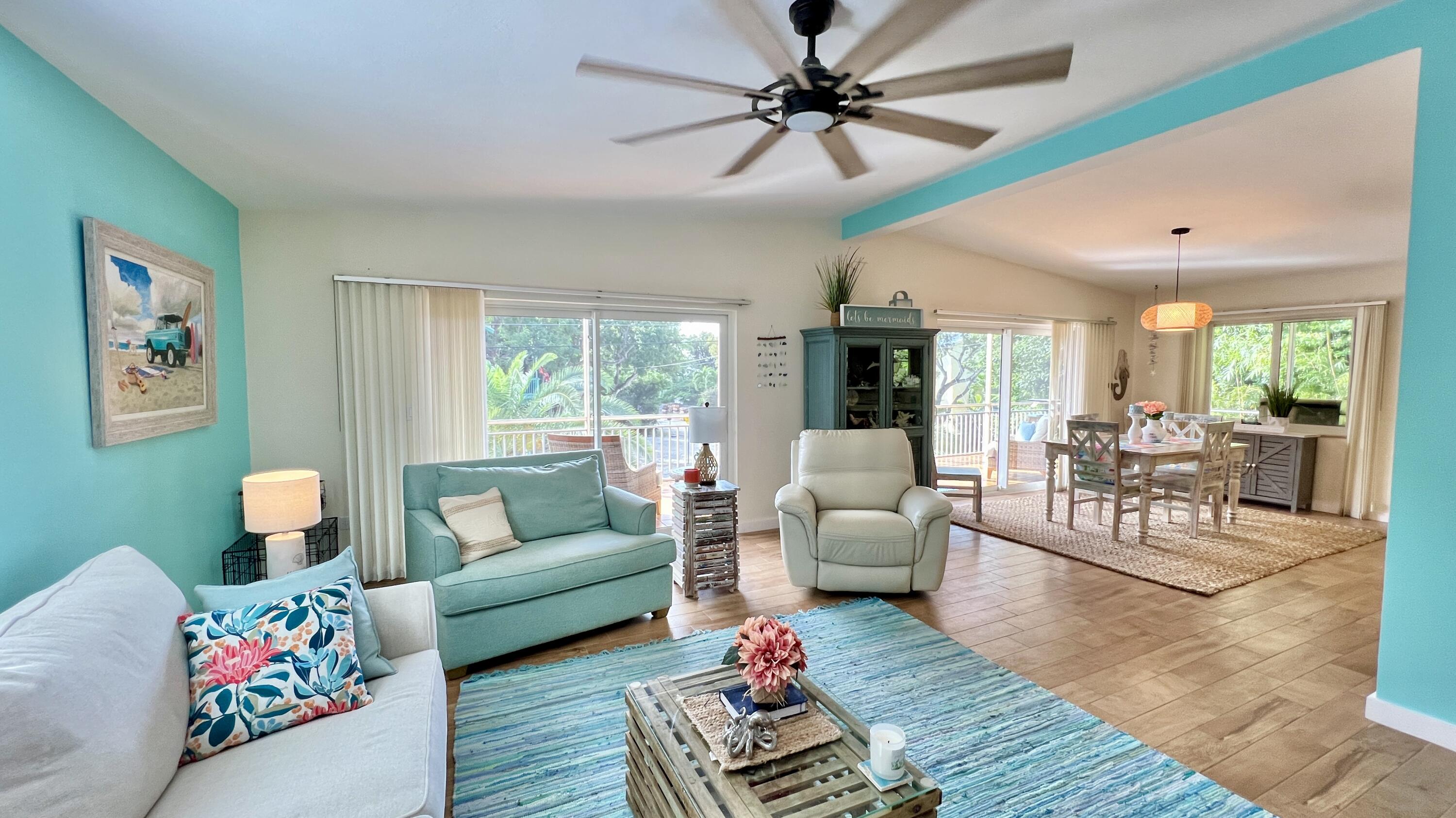 205 Sunset Boulevard Key Largo, FL 33037 - Photo 11 of 42 a living room with furniture and a large window