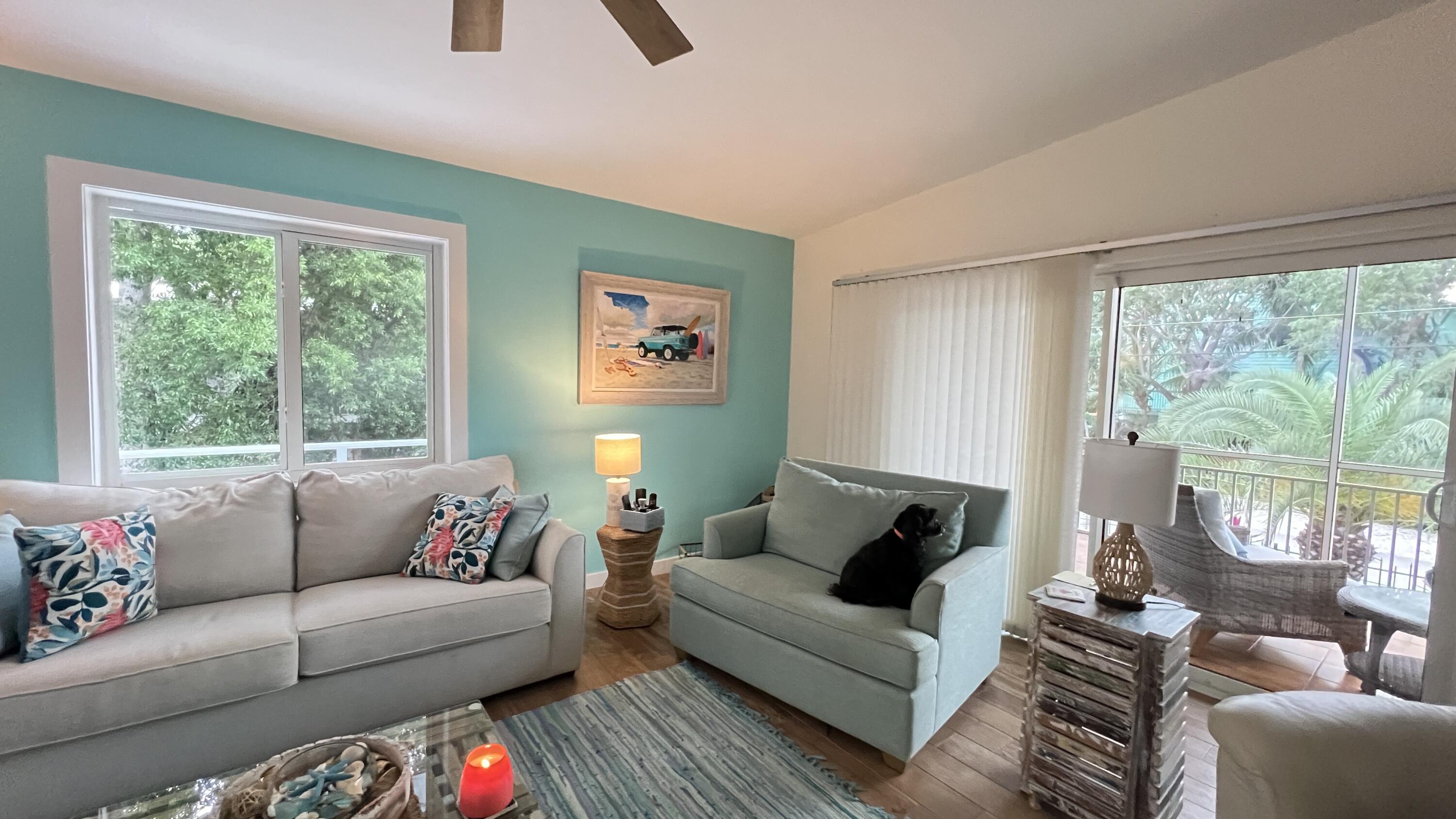 205 Sunset Boulevard Key Largo, FL 33037 - Photo 12 of 42 a living room with furniture and a large window