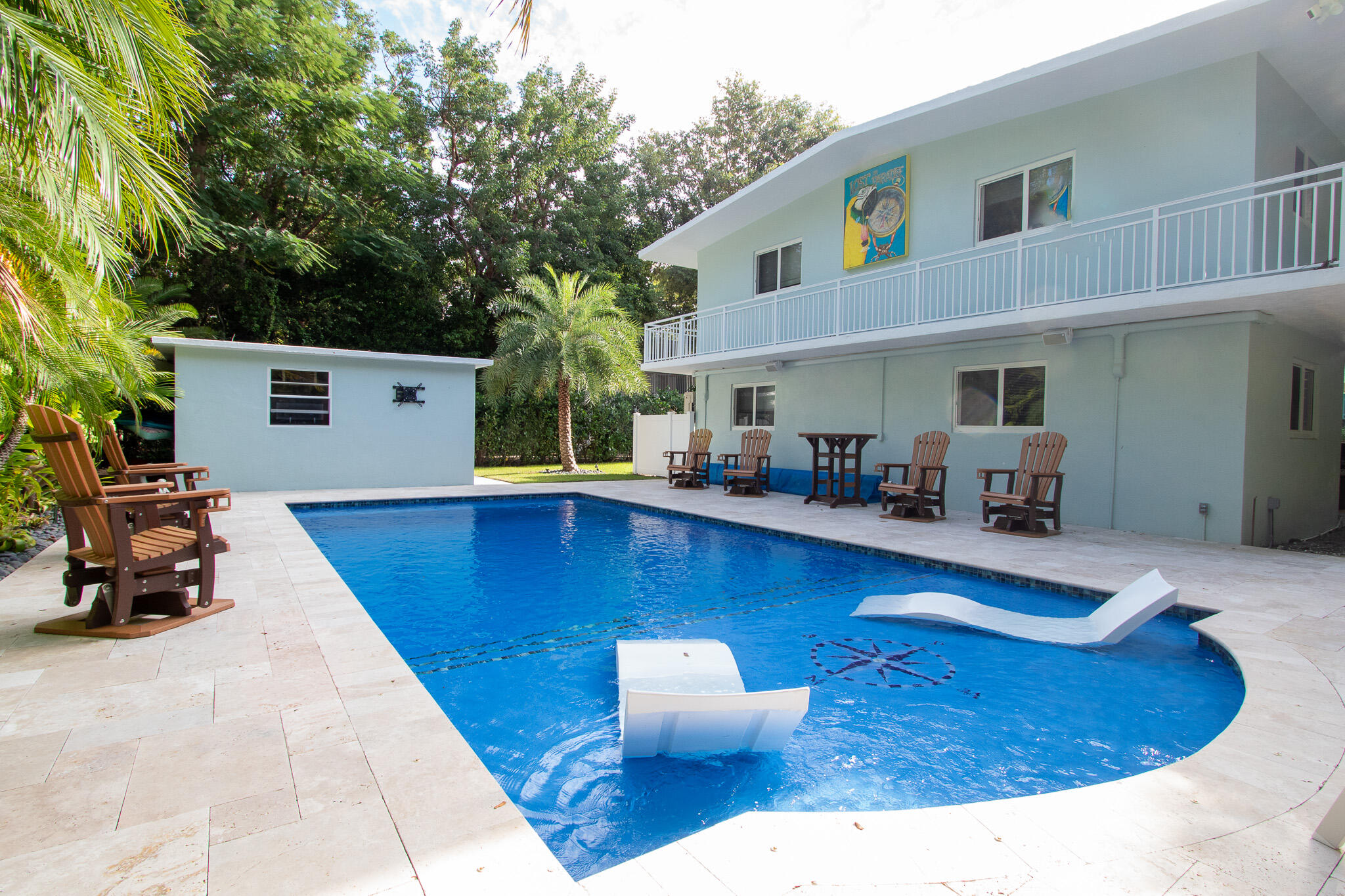 205 Sunset Boulevard Key Largo, FL 33037 - Photo 2 of 42 a view of a swimming pool with furniture