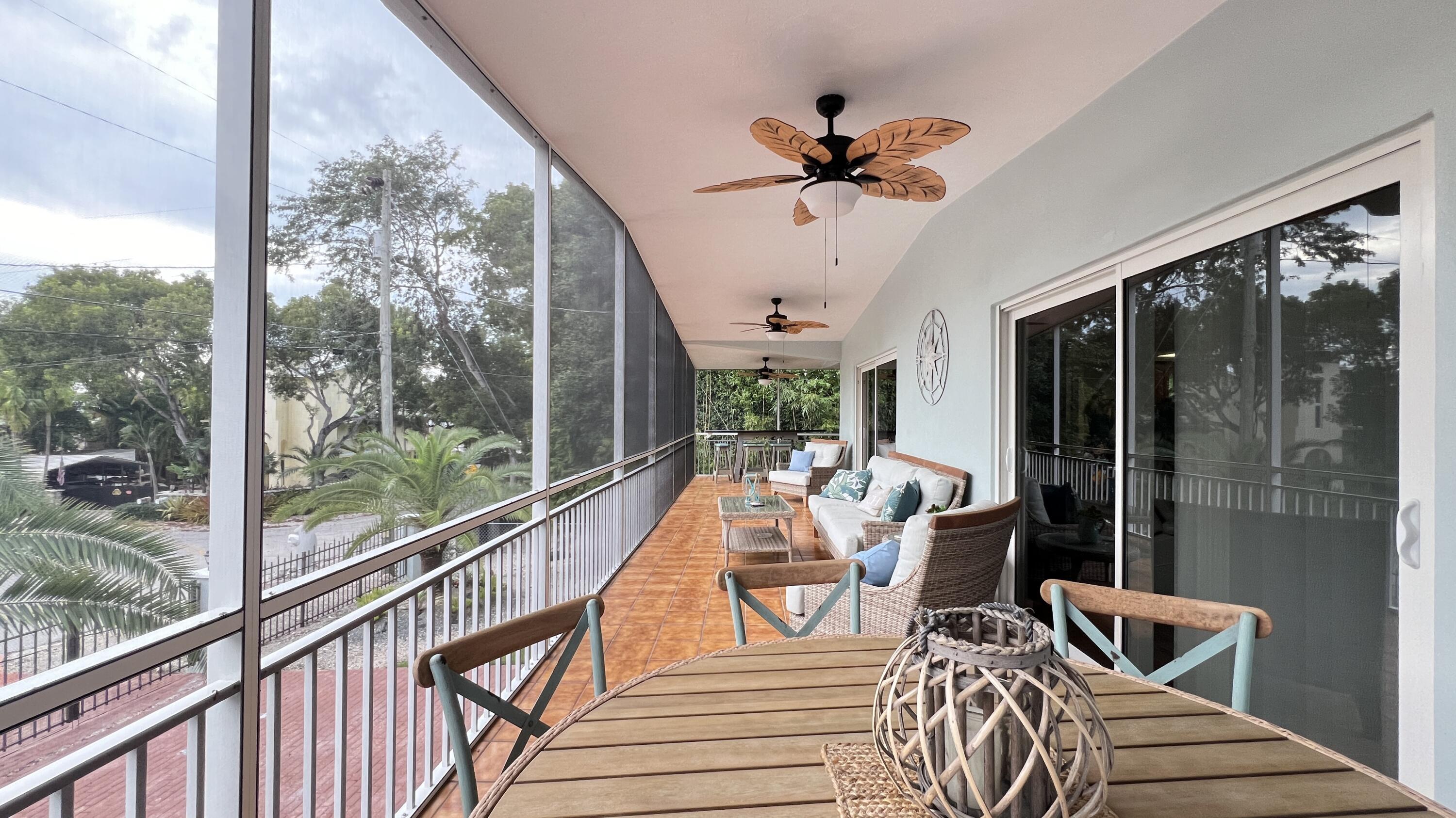 205 Sunset Boulevard Key Largo, FL 33037 - Photo 21 of 42 a view of a dining room with furniture window and outside view