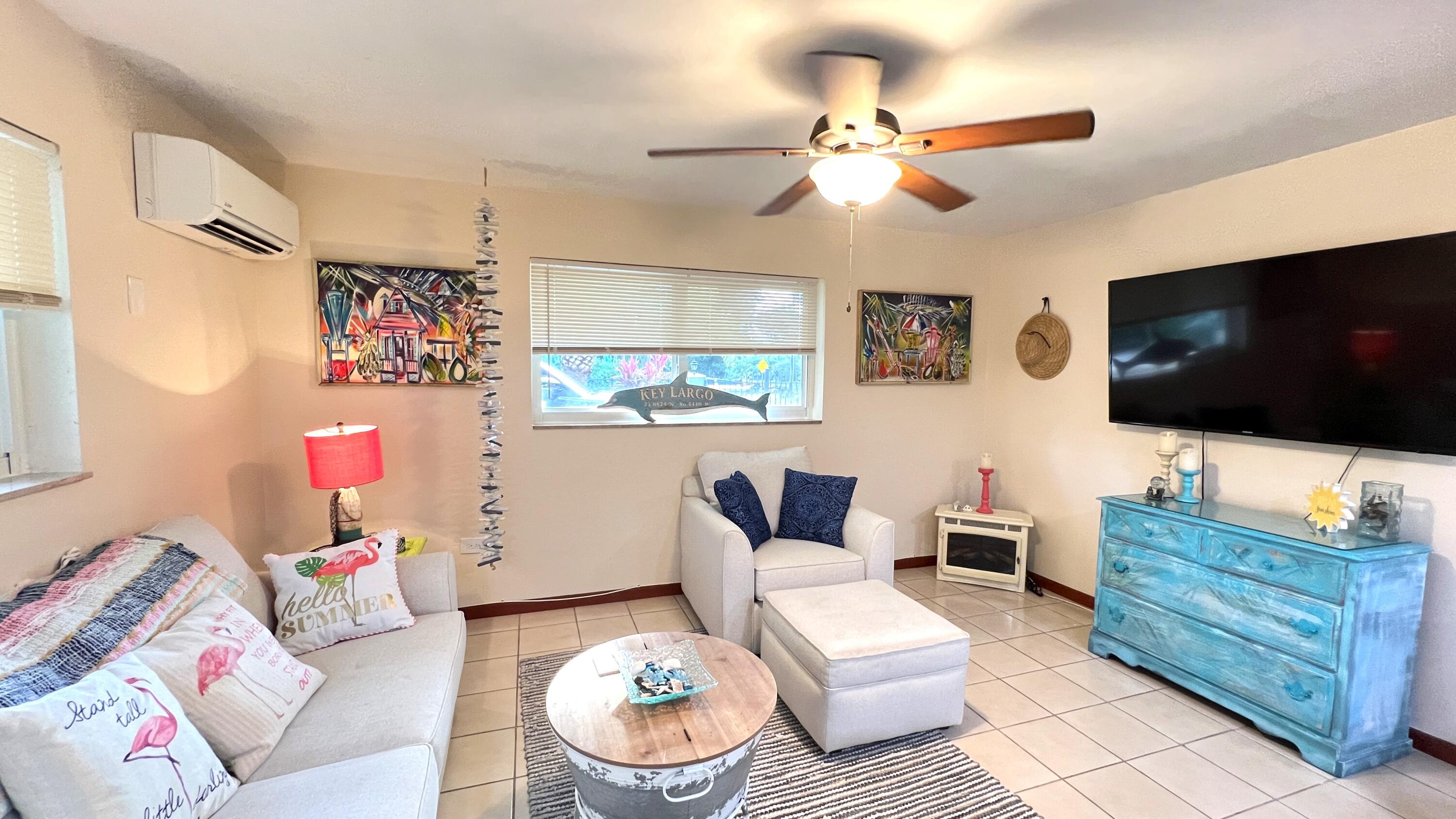 205 Sunset Boulevard Key Largo, FL 33037 - Photo 24 of 42 a living room with furniture and a flat screen tv