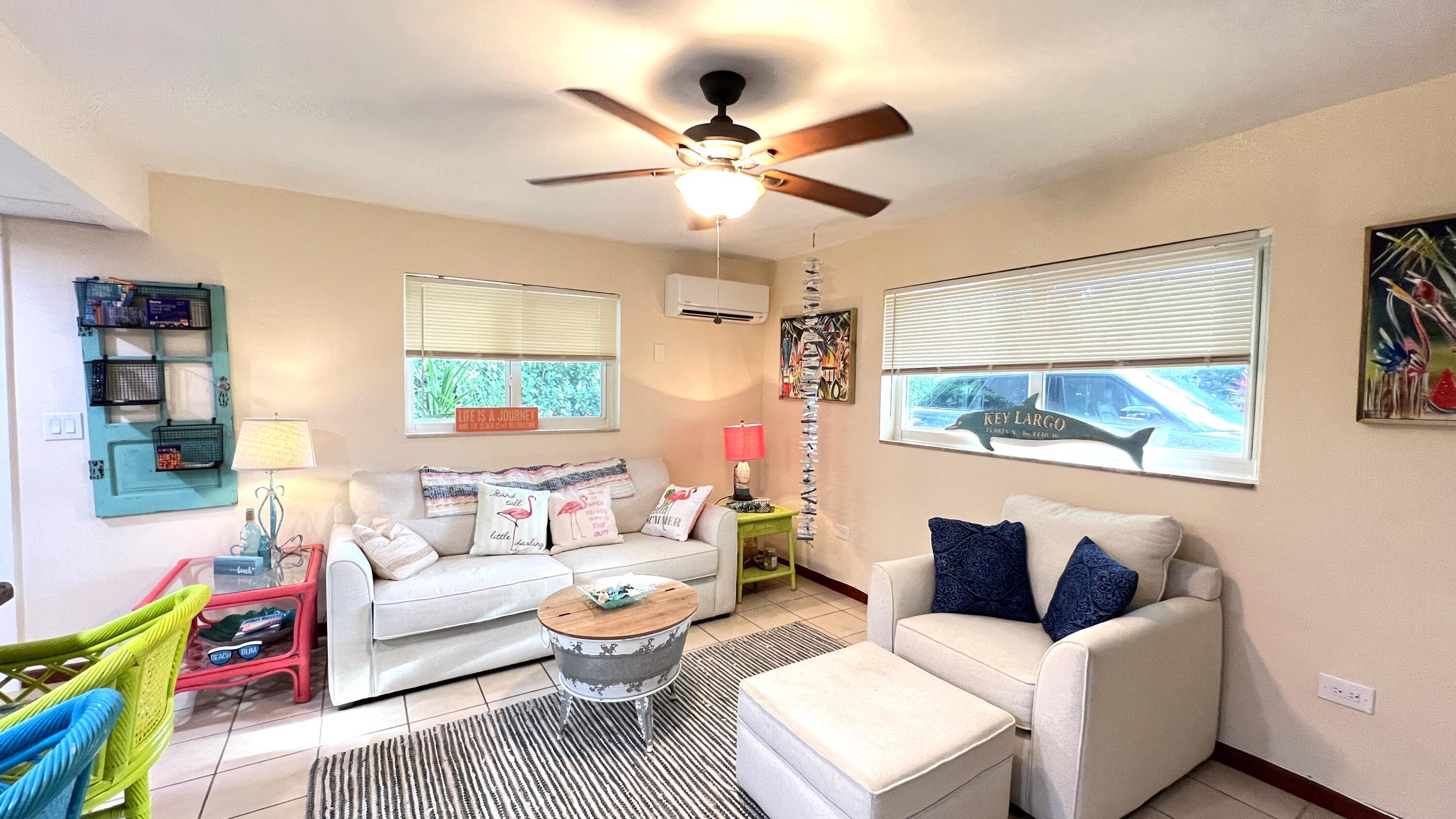 205 Sunset Boulevard Key Largo, FL 33037 - Photo 25 of 42 a living room with furniture and a window