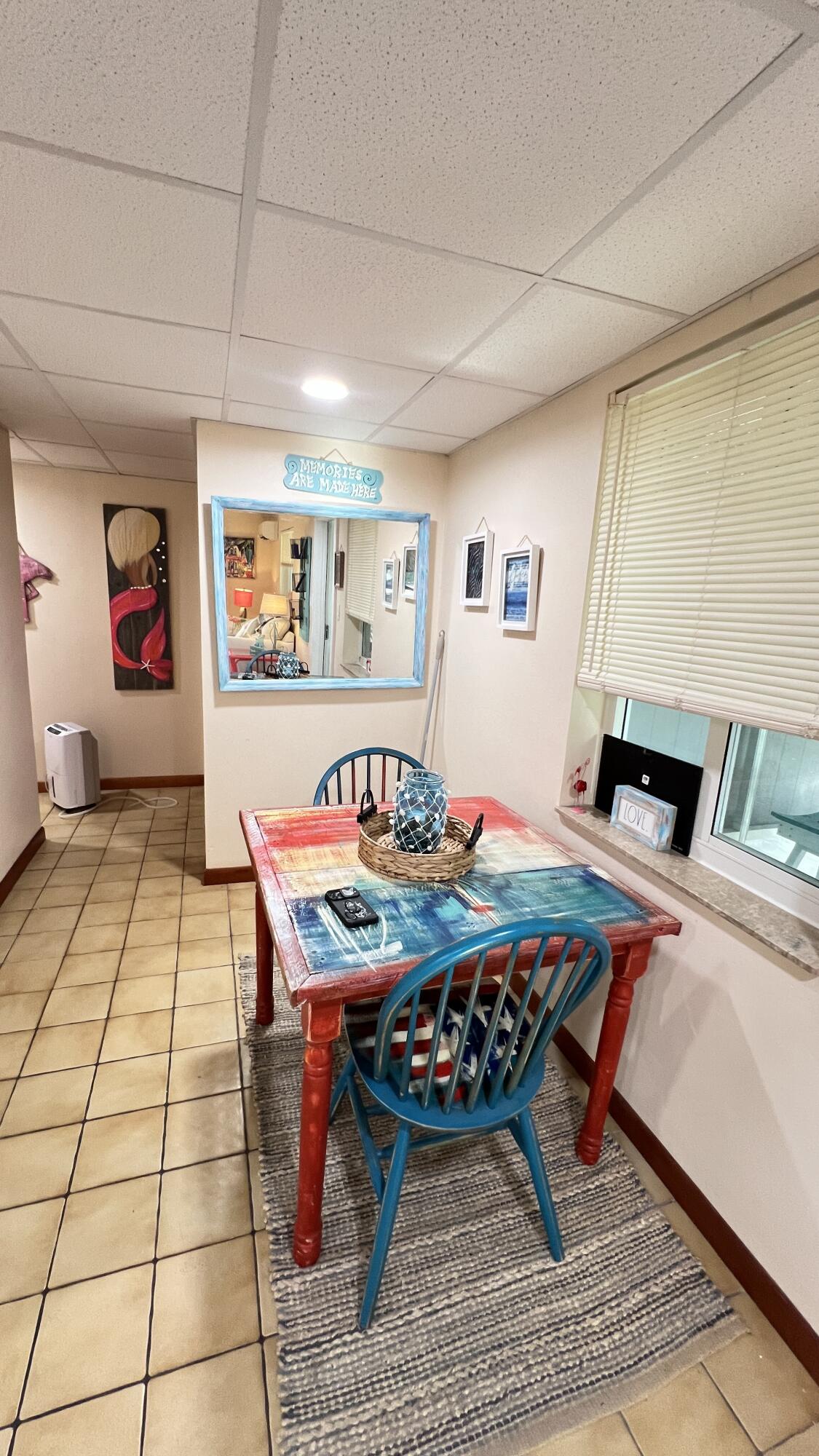 205 Sunset Boulevard Key Largo, FL 33037 - Photo 29 of 42 a living room with furniture and painting on the wall