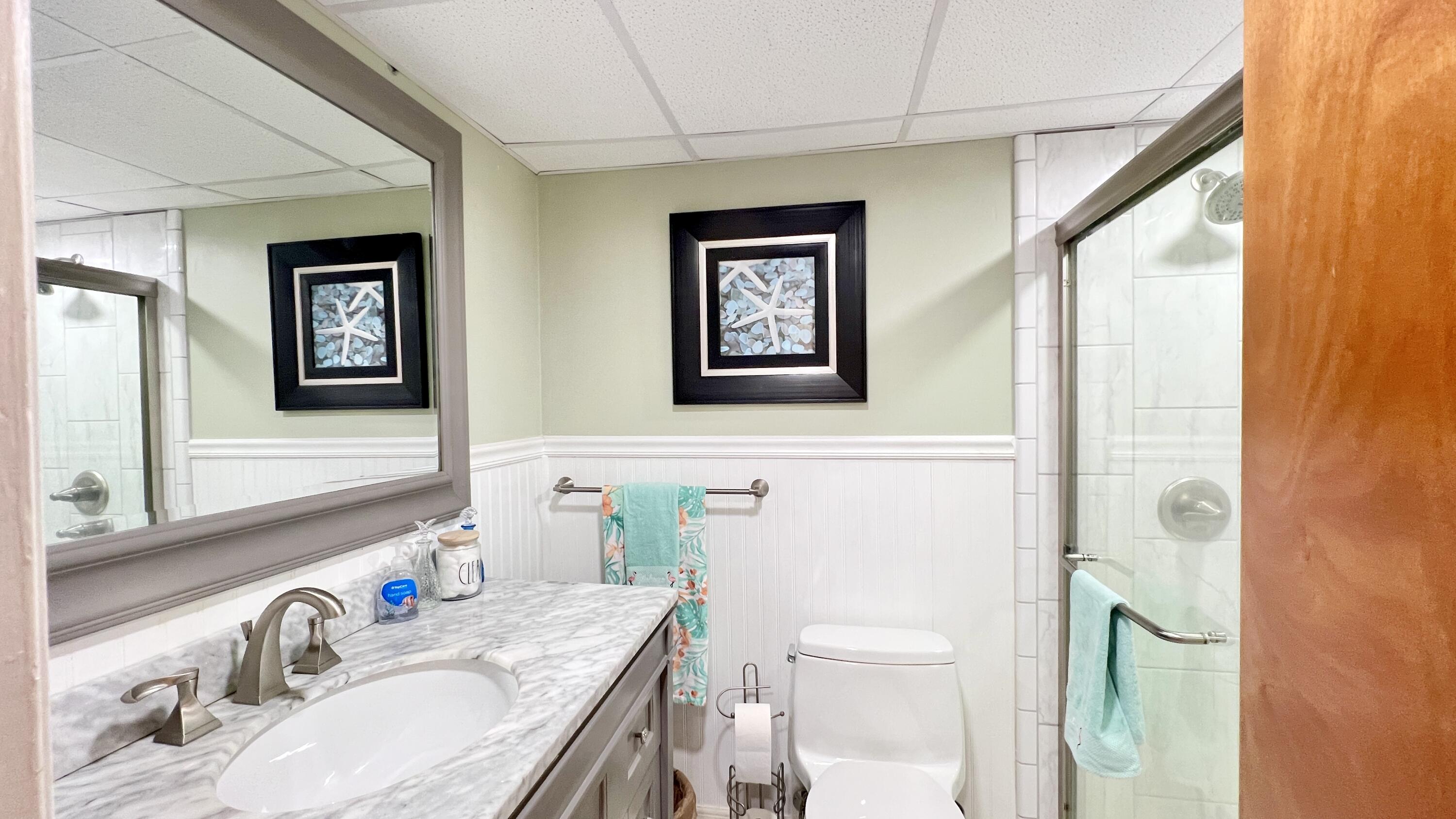 205 Sunset Boulevard Key Largo, FL 33037 - Photo 32 of 42 a bathroom with a granite countertop sink toilet and shower