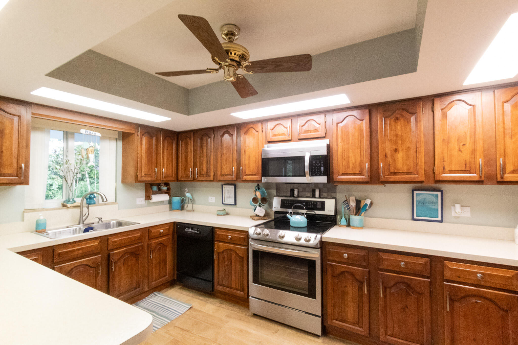 205 Sunset Boulevard Key Largo, FL 33037 - Photo 7 of 42 a kitchen with a sink stove and cabinets