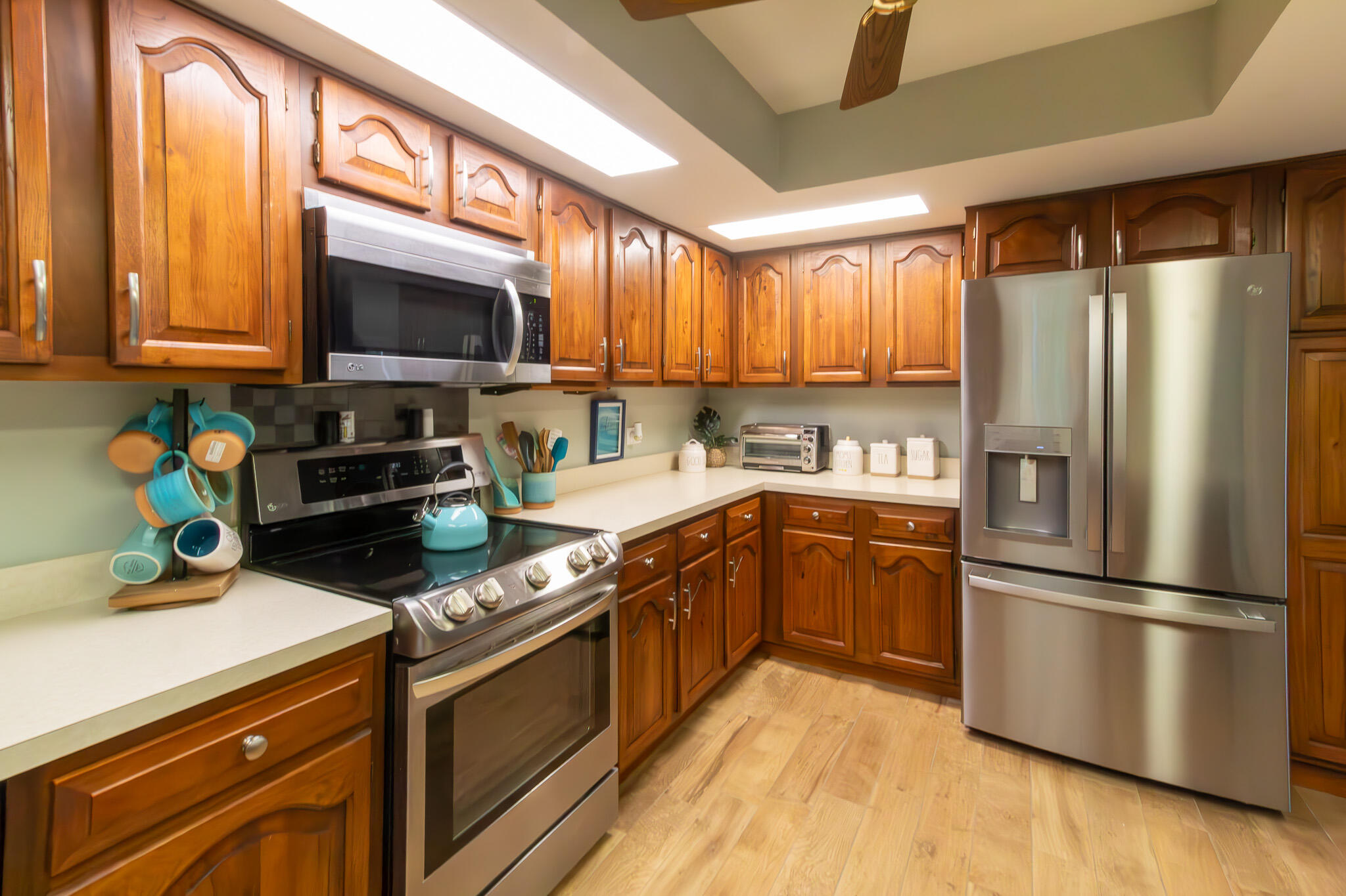 205 Sunset Boulevard Key Largo, FL 33037 - Photo 8 of 42 a kitchen with stainless steel appliances granite countertop a refrigerator sink and microwave