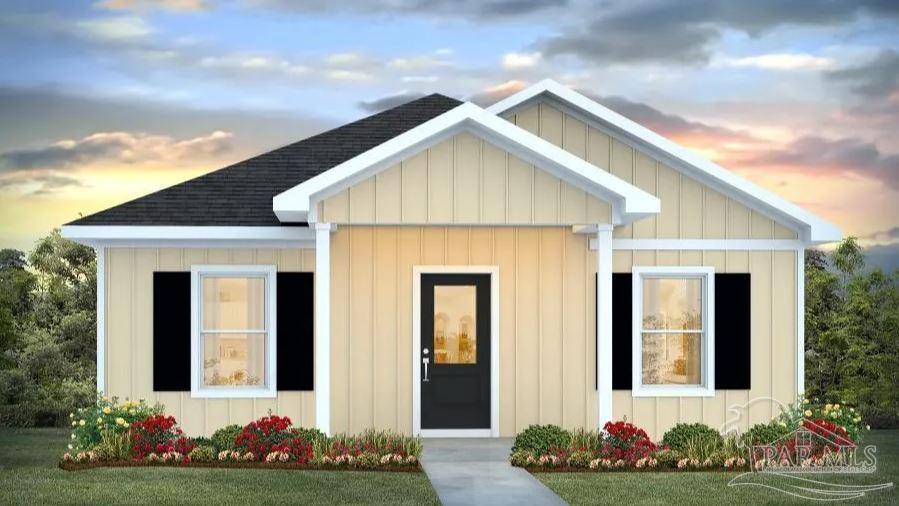 6461 Firefly Drive Milton, FL 32583 - Photo 1 of 36 a front view of a house with a garden