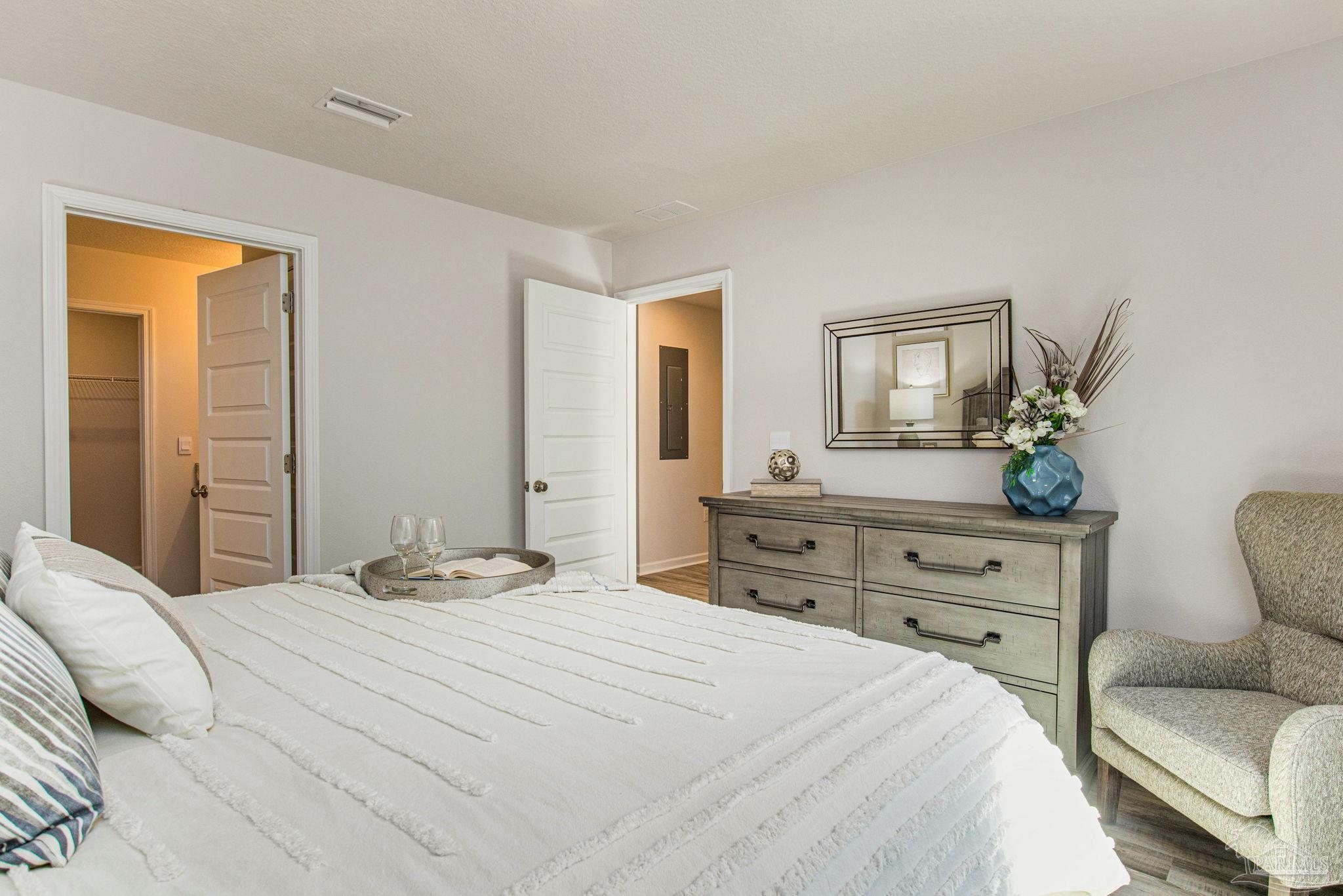 6461 Firefly Drive Milton, FL 32583 - Photo 12 of 36 a bedroom with a bed and a couch