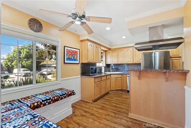 a kitchen with stainless steel appliances granite countertop a stove and cabinets