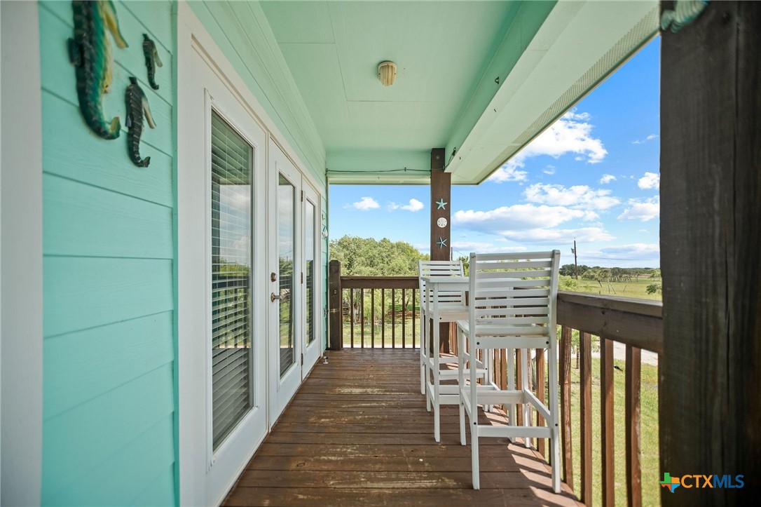 23 Macey Street Port O'Connor, TX 77982 - Photo 11 of 47 a view of a balcony with chairs