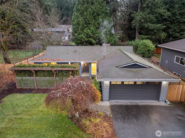 an aerial view of a house with a yard