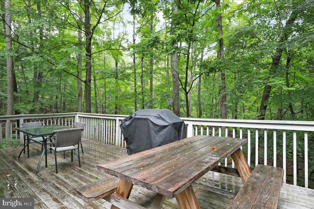 13 Mountainside Loop Berkeley Springs, WV 25411 - Photo 15 of 57 a view of a table and chairs on the roof deck