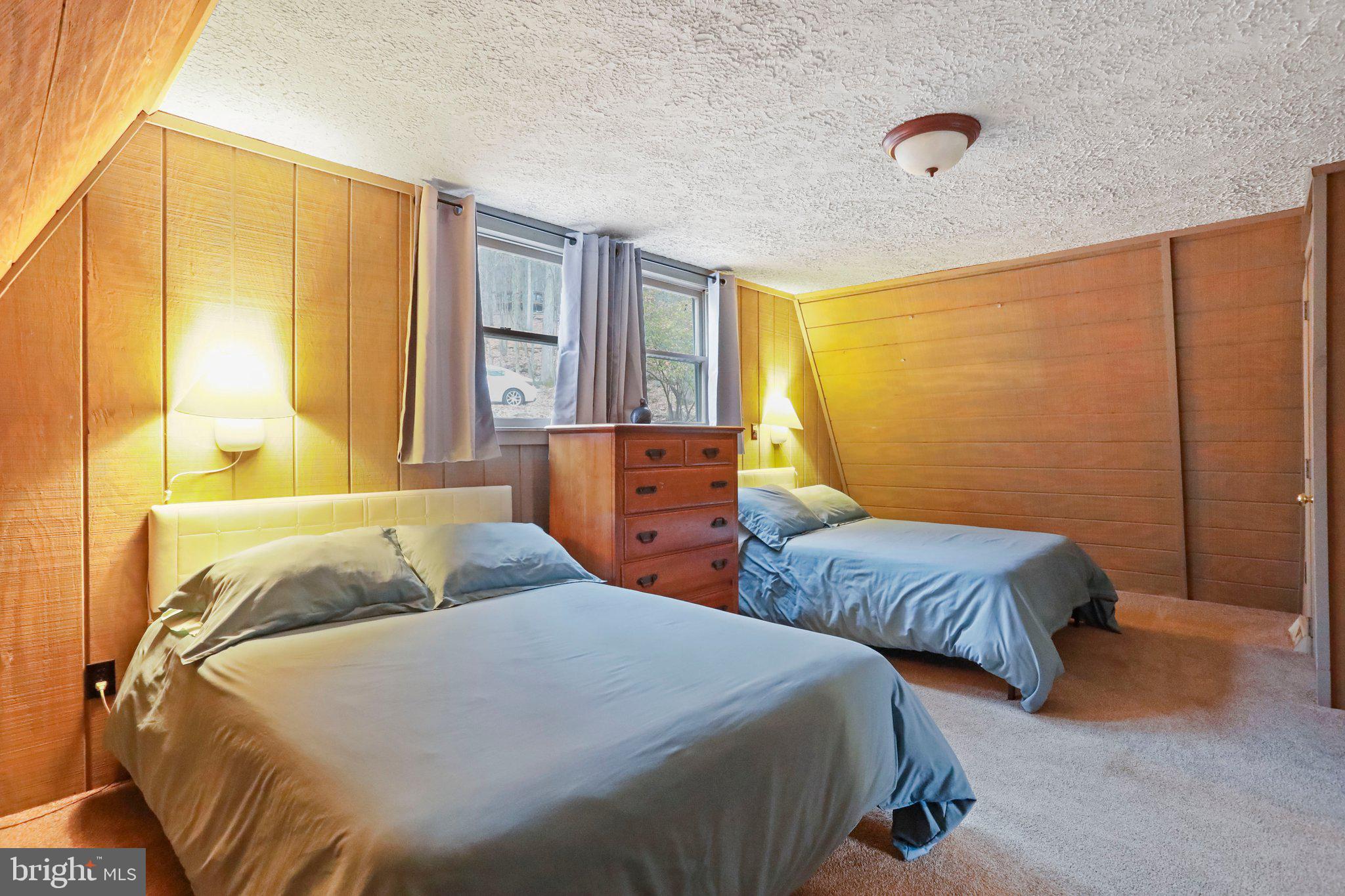 13 Mountainside Loop Berkeley Springs, WV 25411 - Photo 23 of 57 a bedroom with two beds and painted walls