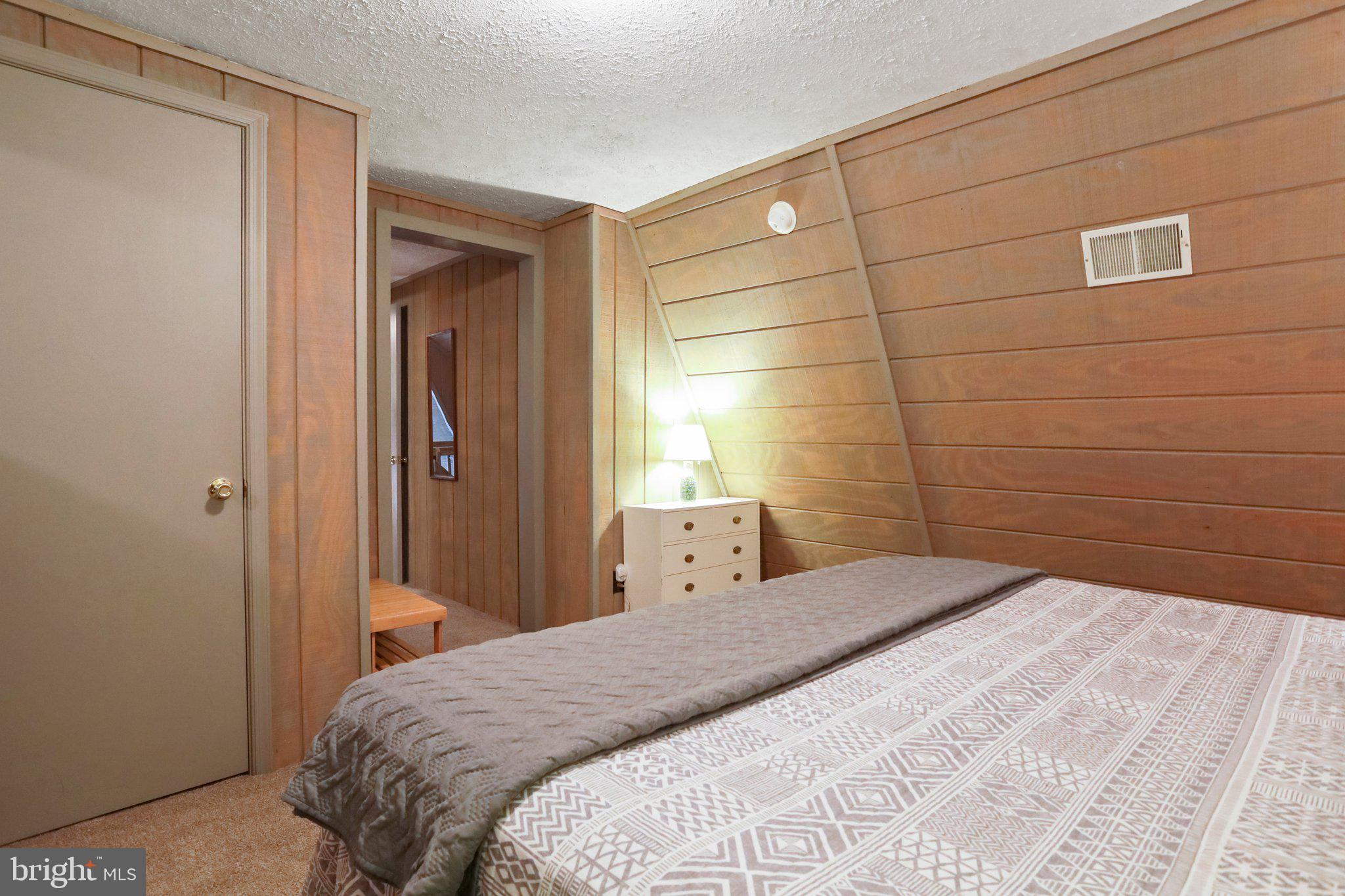 13 Mountainside Loop Berkeley Springs, WV 25411 - Photo 26 of 57 a bedroom with a bed and a window